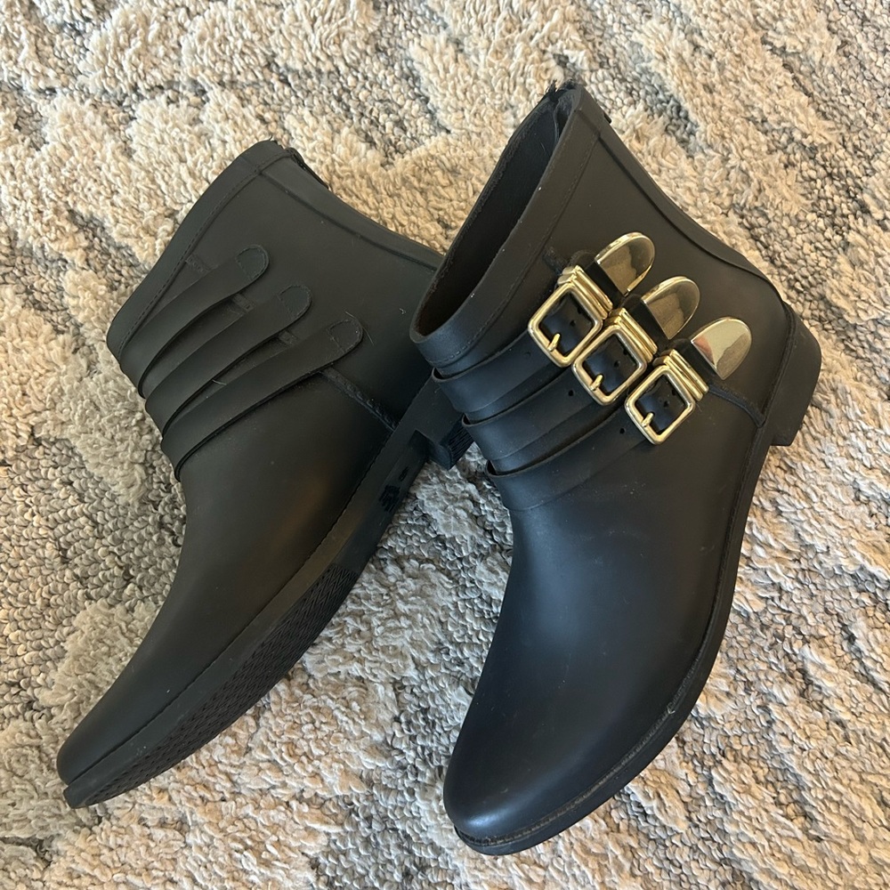 Loeffler Randall Black and Gold Ankle Booties with Sleek Design